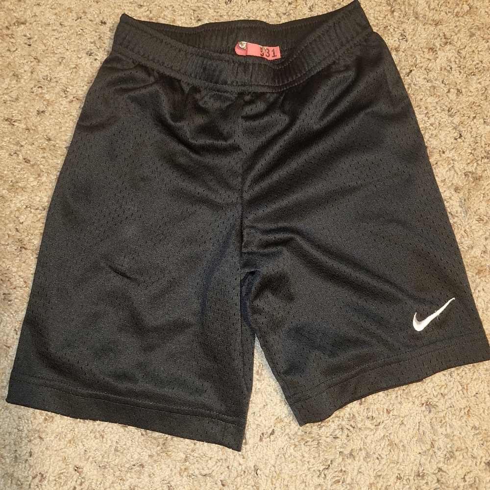 KIDS NIKE shorts. BLACK. SIZE 6/7 yrs.